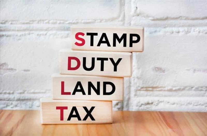avoid SDLT surcharge UK expat mortgage